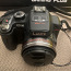 Panasonic Lumix DMC-FZ100 14.1 MP (foto #1)