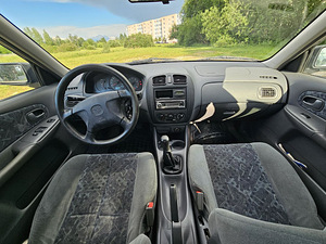 Mazda 323f 1998 aasta (2 foto / 12)