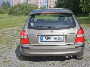 Mazda 323f 1998 aasta (11 foto / 12)