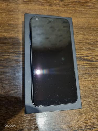 LG Q7 с двумя SIM-картами, 32 ГБ, черный (фото #1)