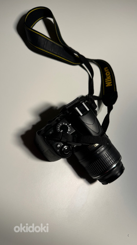 Зеркальная фотокамера Nikon D3100 (фото #1)