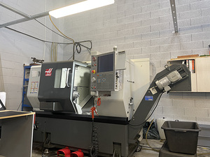 HAAS ST-10 + bar feeder Haas servo bar 300 (1 foto / 7)