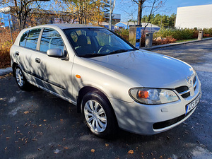 Nissan Almera N16 (6 foto / 15)