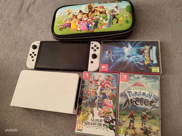 Nintendo Switch OLED + Games + Case (foto #1)